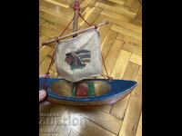 Wooden toy ship with an Indian