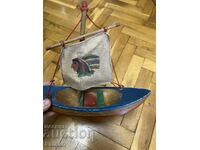 Wooden toy ship with an Indian