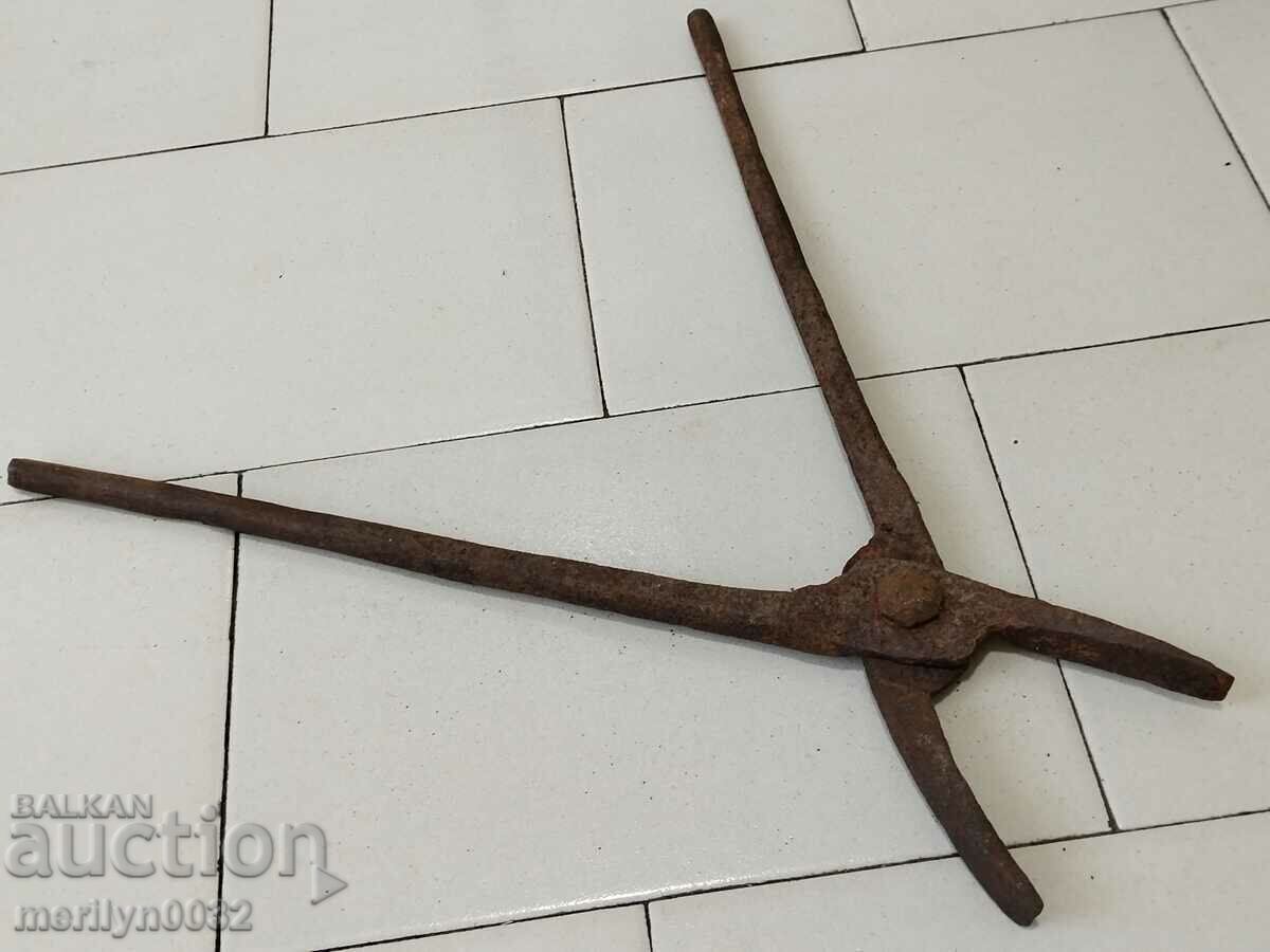 Old blacksmith's tongs, shingles, wrought iron