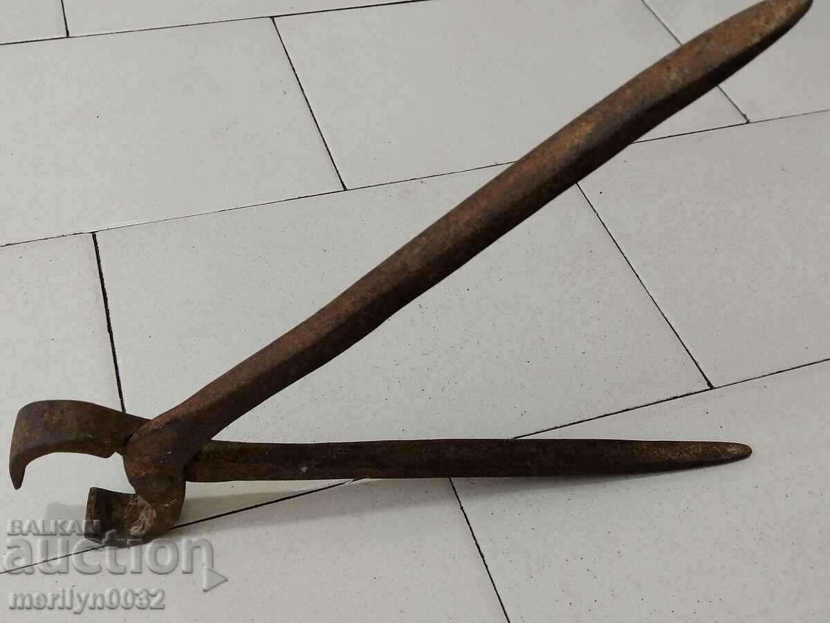 Auction  Old blacksmith's tongs, shingles, wrought iron