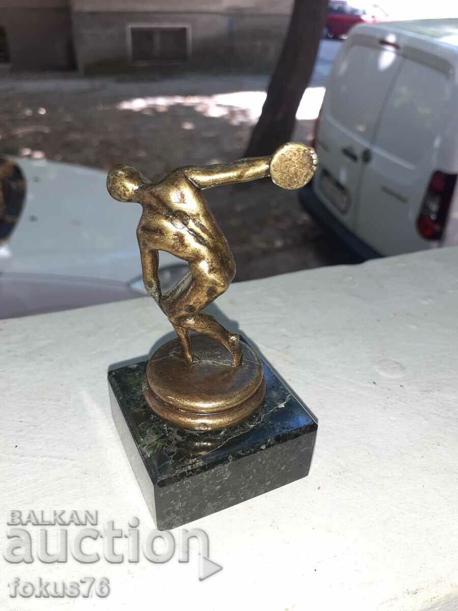 A small metal figurine of a discus thrower with price 45.00 BGN | € 23.01 A small metal figurine of a discus thrower with price 45.00 BGN | € 23.01