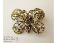 Old lady's jewel butterfly brooch with gilding and stones