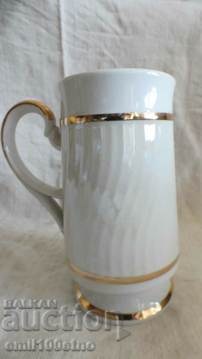 Auction Mug souvenir with the coat of arms of Riga and many gilt porcelain USSR Auction Mug souvenir with the coat of arms of Riga and many gilt porcelain USSR