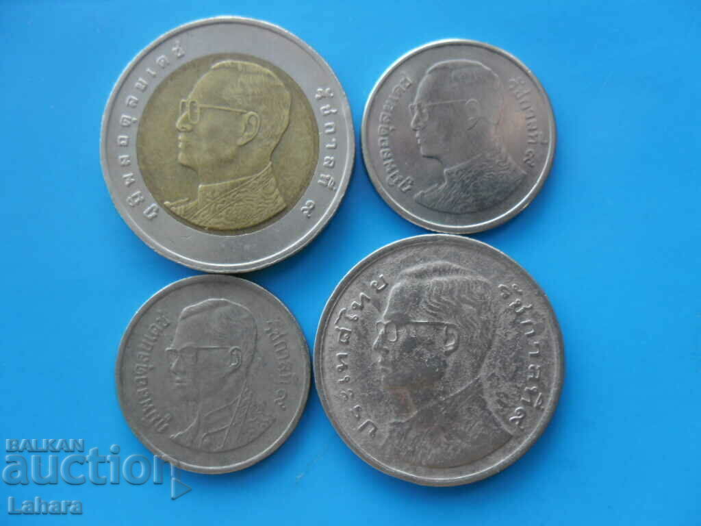 O mulțime de monede Thailanda