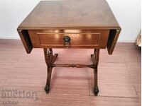 A solid wooden table or bedside table