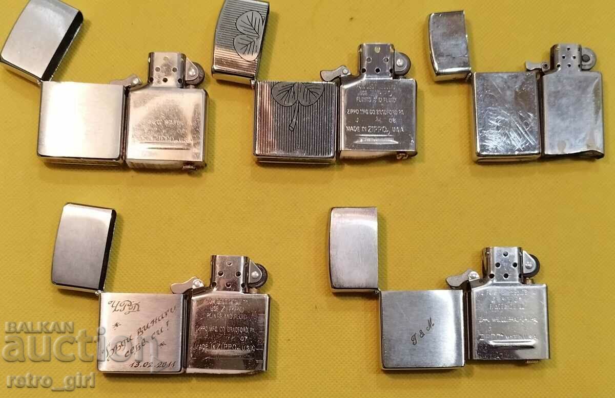Delivery of Lot of 5 "ZIPPO" lighters. Delivery of Lot of 5 "ZIPPO" lighters.