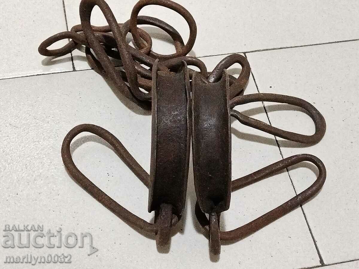 Auction Pair of buckles, shackles, chain, wrought iron Auction Pair of buckles, shackles, chain, wrought iron