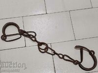 Pair of buckles, shackles, chain, wrought iron