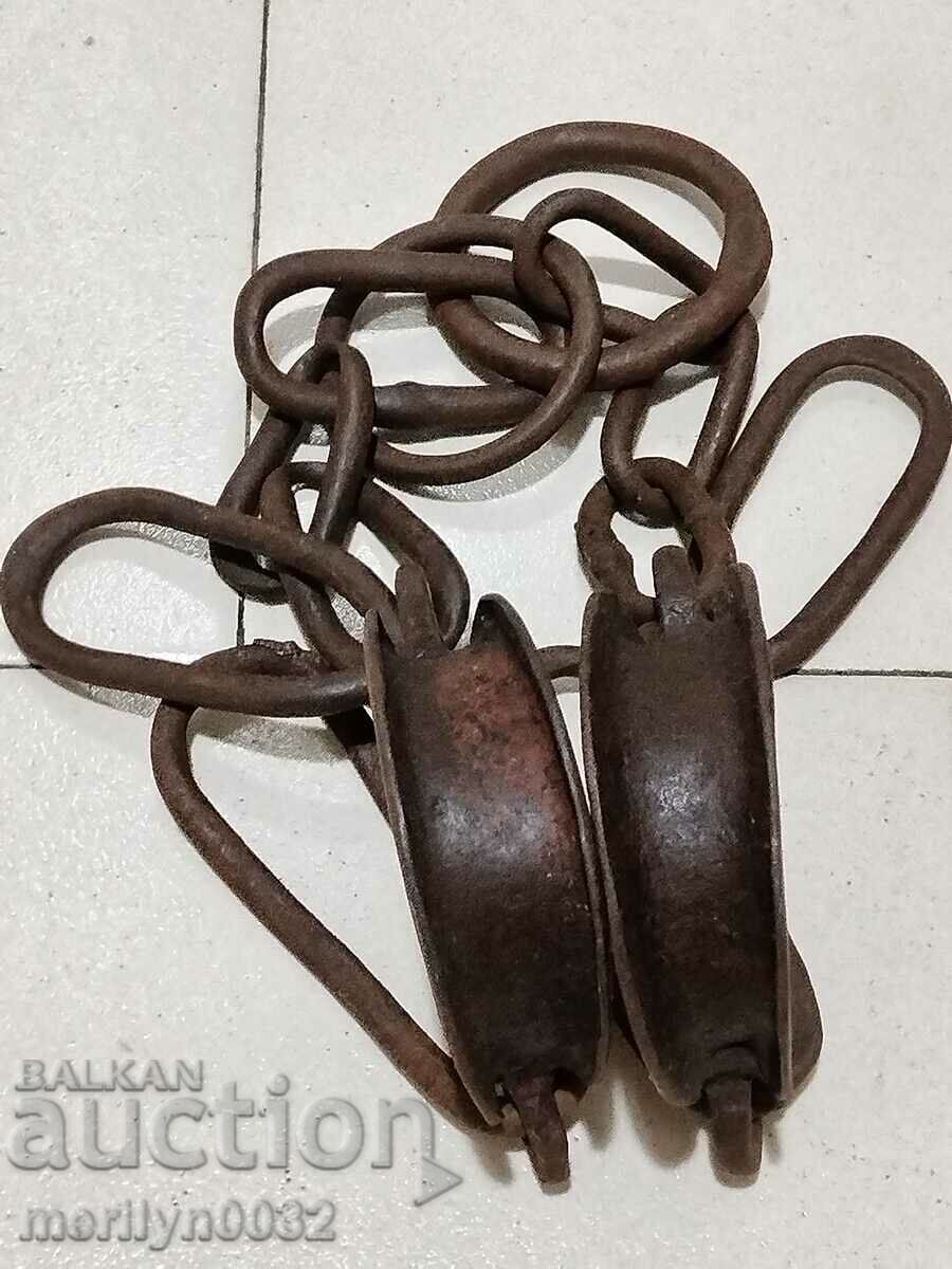 Auction Pair of buckles, shackles, chain, wrought iron Auction Pair of buckles, shackles, chain, wrought iron