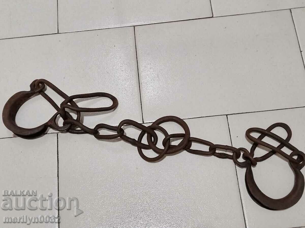 Pair of buckles, shackles, chain, wrought iron Pair of buckles, shackles, chain, wrought iron