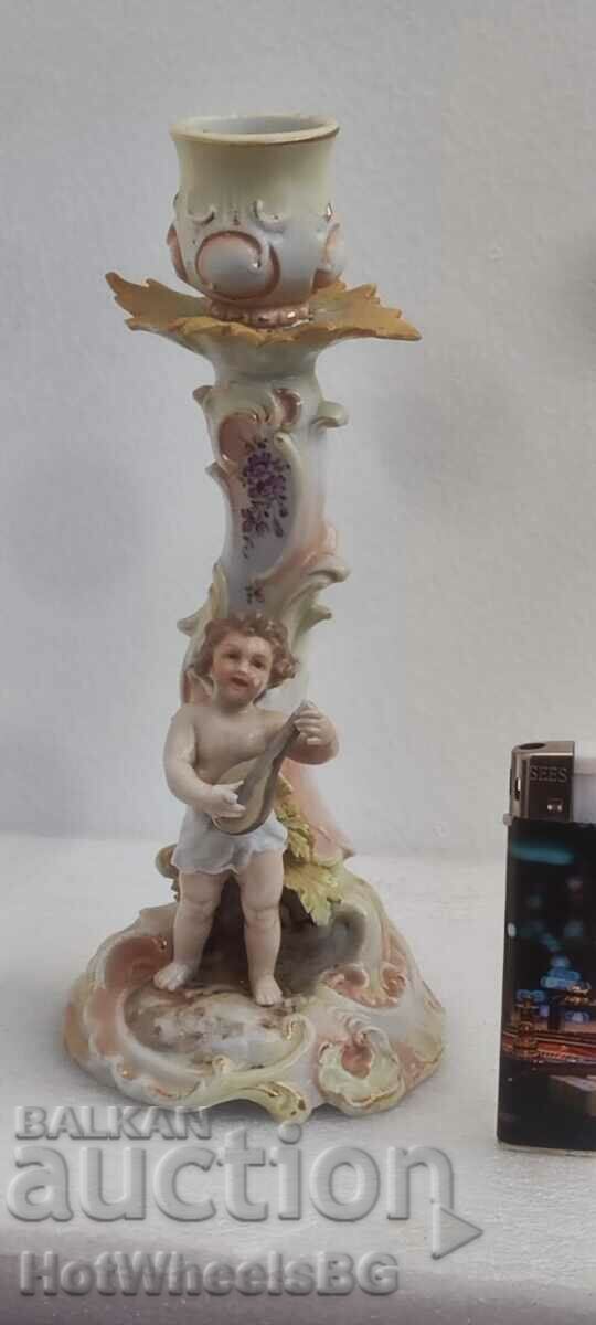Porcelain candlestick figurine with markings