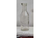 Old glass milk bottle, bottle with inscription