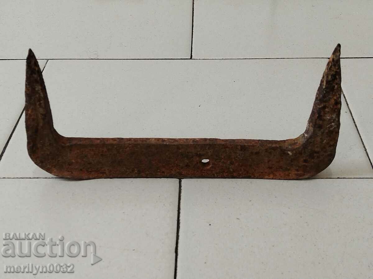 Old hand-forged scraper wrought iron bracket