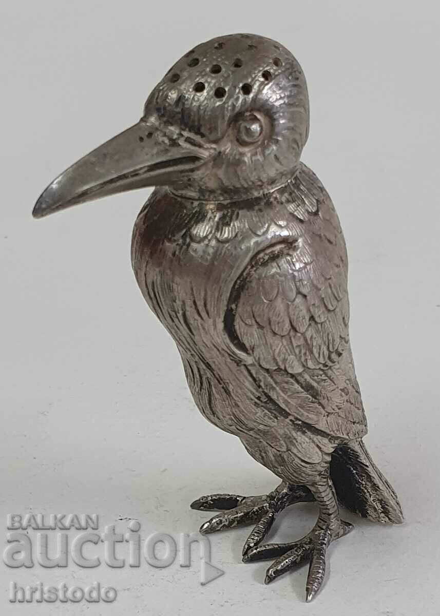 Old silver salt shaker woodpecker