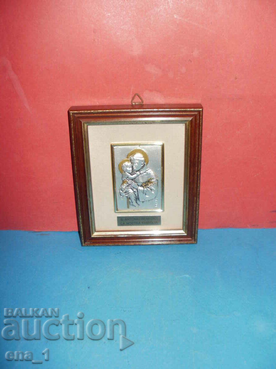 A small icon of St. Antony in a beautiful wooden frame
