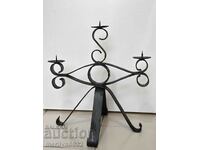 Old forged candlestick, candle