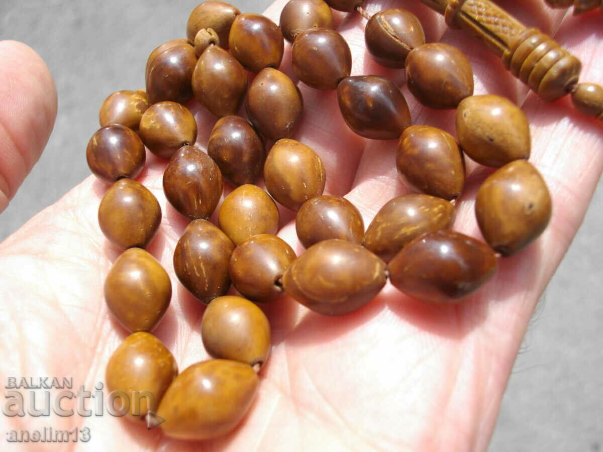 Delivery of AN OLD ROSARY OF BONE OR SOME WOOD