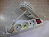 Extension cord with four-socket plug and button - 3 m.