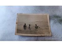 Photo Three men in the sea