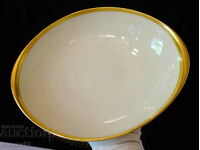 Furstenberg deep oval plate, gold, 29 cm.