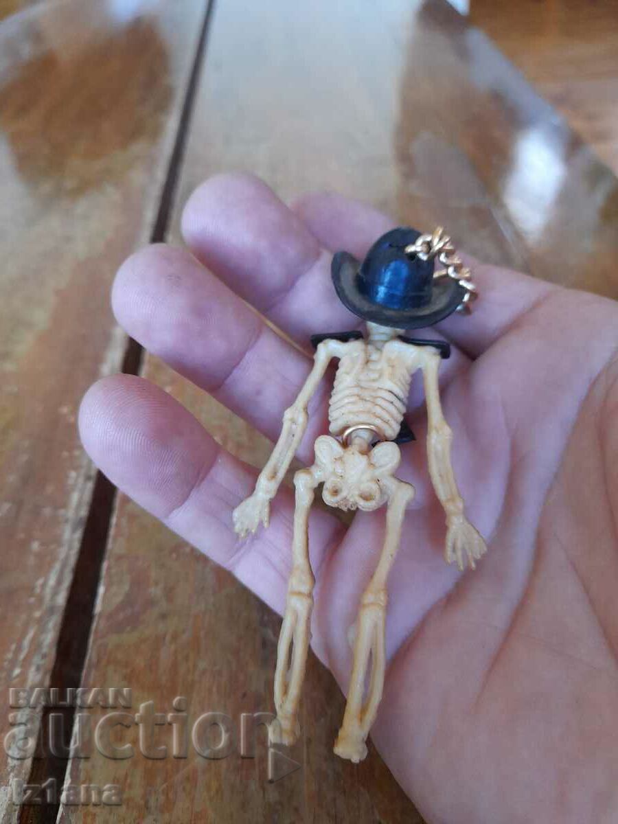 Auction Old doll, cowboy skeleton pendant Auction Old doll, cowboy skeleton pendant