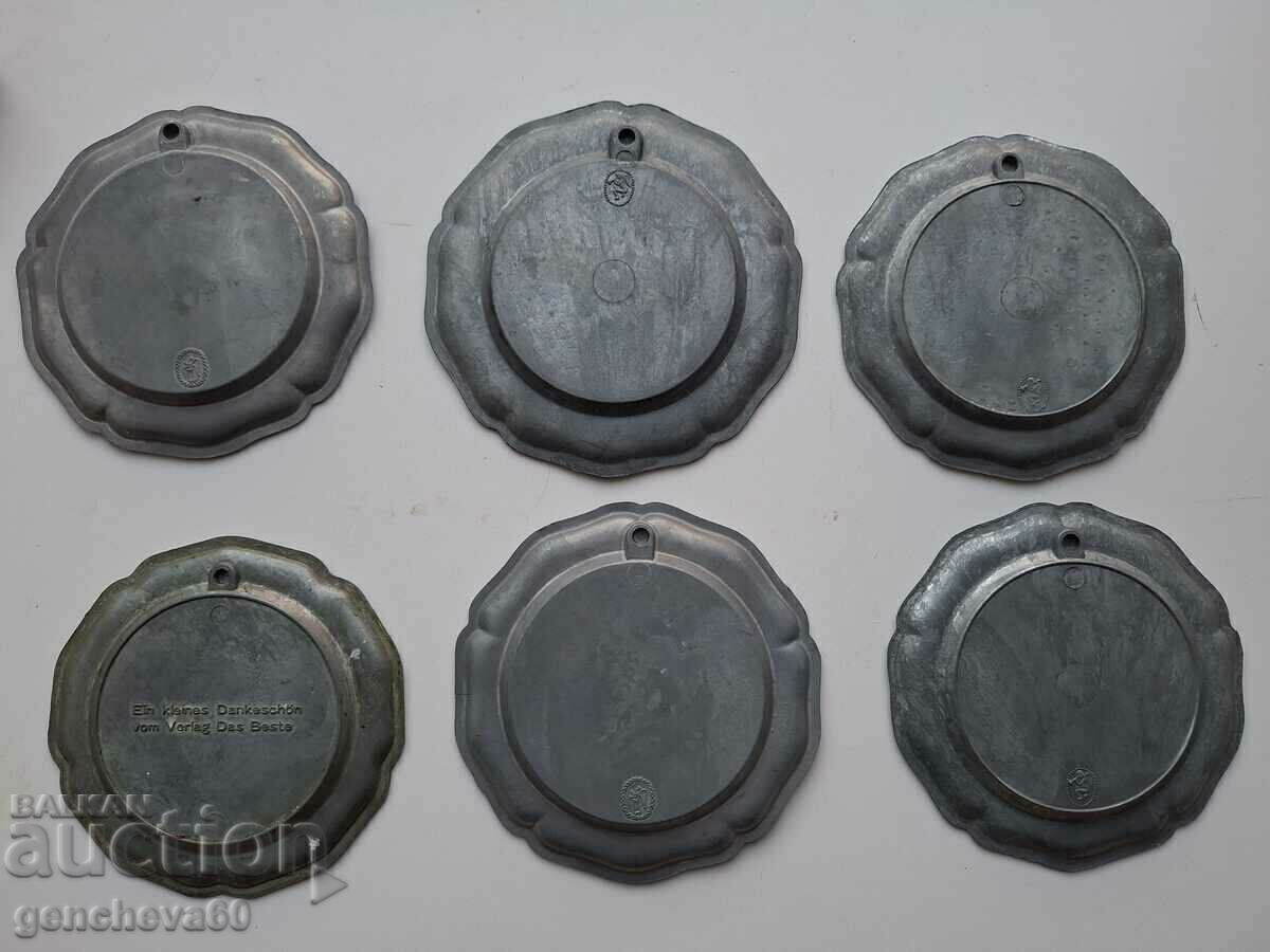 Auction  Beautiful, decorative pewter wall plates