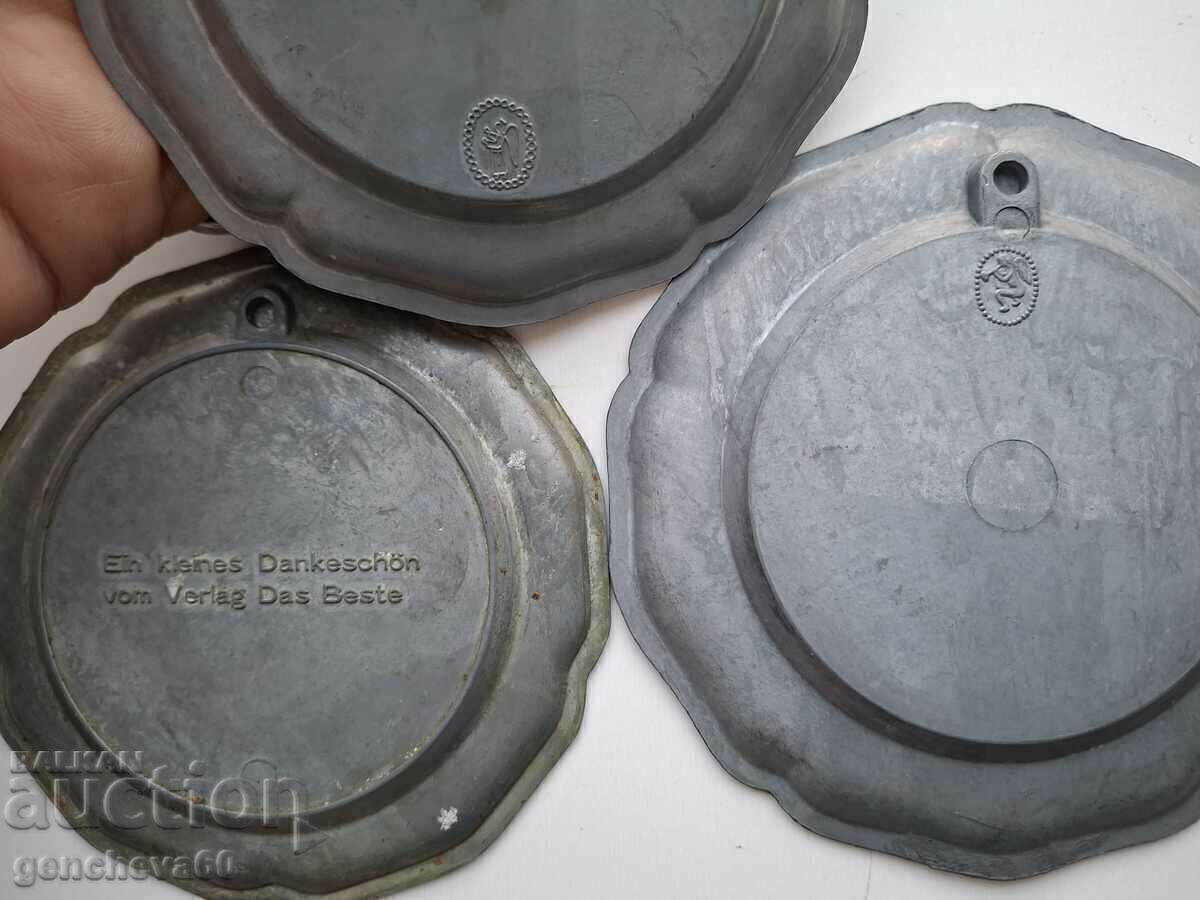 Delivery of Beautiful, decorative pewter wall plates