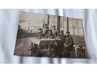 Photo Six Border Guard officers sitting at a table