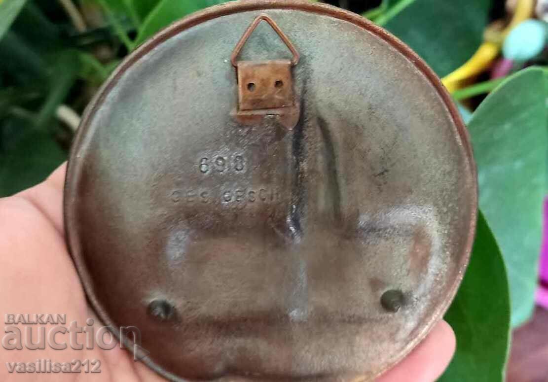 Auction  A metal saucer