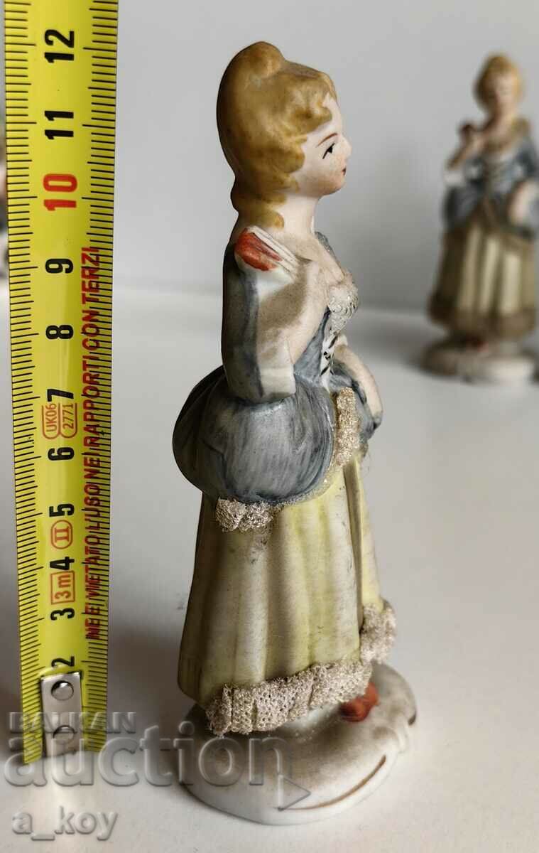 Auction PORCELAIN STATUETTE FIGURE OF A HEALTHY WOMAN Auction PORCELAIN STATUETTE FIGURE OF A HEALTHY WOMAN