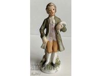 PORCELAIN STATUETTE FIGURINE OF A MAN WITH A NOTE