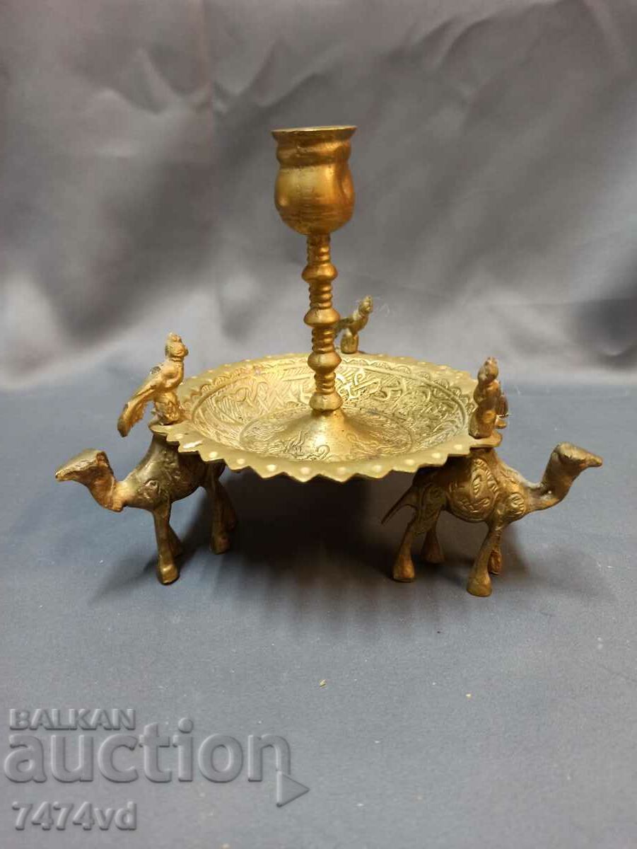 Bronze candlestick with camel birds at the top and ornaments