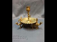 Bronze candlestick with camel birds at the top and ornaments