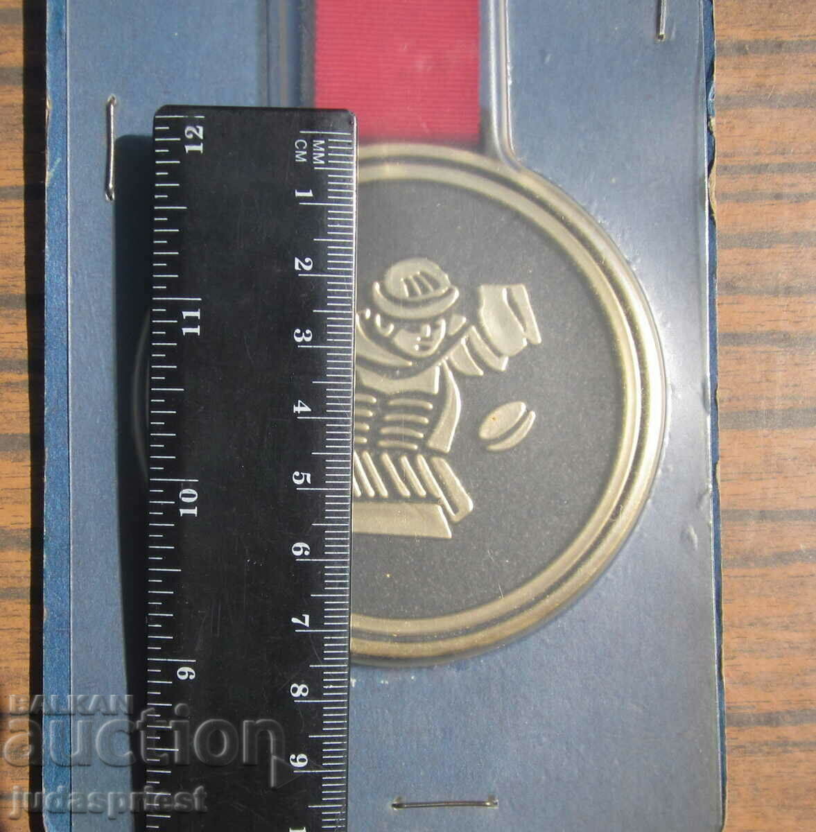 Delivery of ice hockey Russian souvenir gold puck from 1986