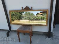 A large mirror in a massive wooden frame!!!