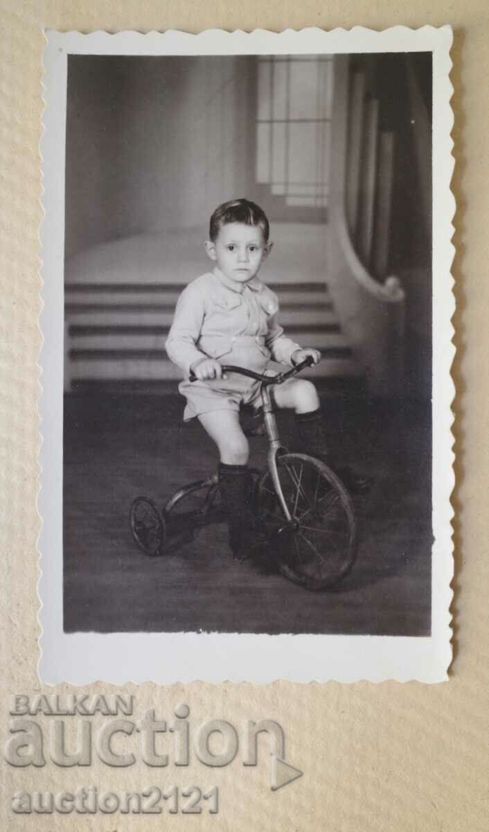 A child on a tricycle