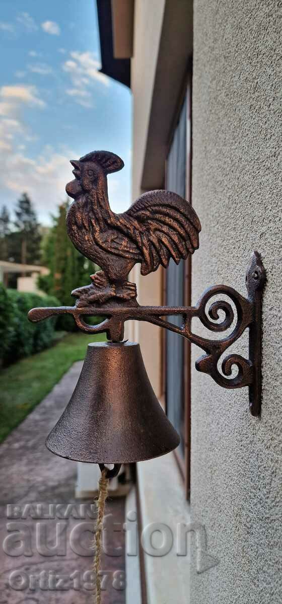 Cast iron bell with rooster. Cast iron bell with rooster.