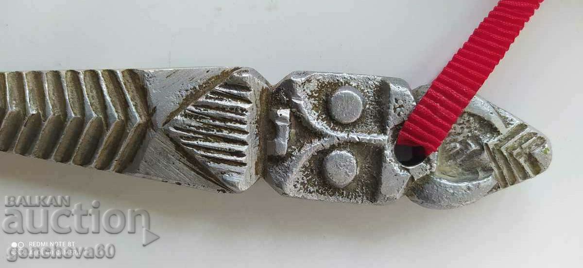 Auction  Very old aluminum shoe rack