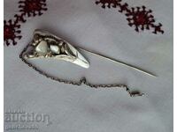 Designer silver pin