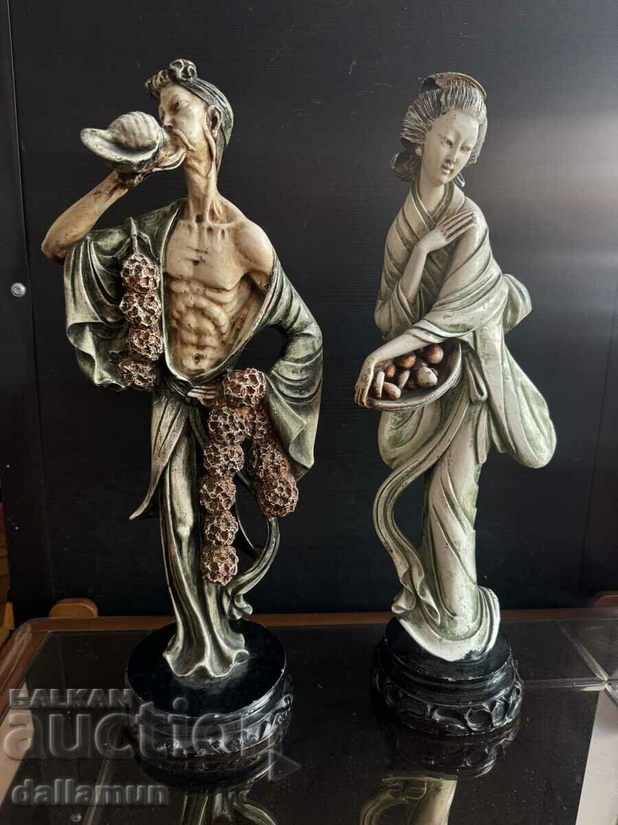 A pair of antique figurines for decor