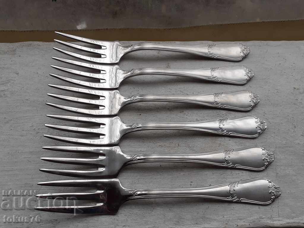 A set of luxury branded Guy Degrenne silver plated forks