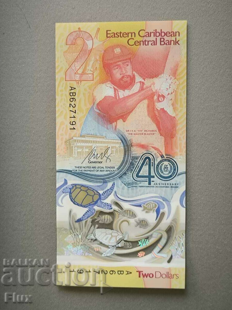 Банкнота - Източни Кариби - 2 долара (юбилейна) UNC | 2023г. с цена 14.00 лв. | € 7.16 Банкнота - Източни Кариби - 2 долара (юбилейна) UNC | 2023г. с цена 14.00 лв. | € 7.16