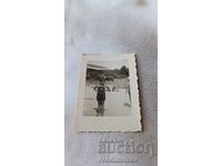 Photo St. Konstantinou Young girl in vintage swimsuit on the beach