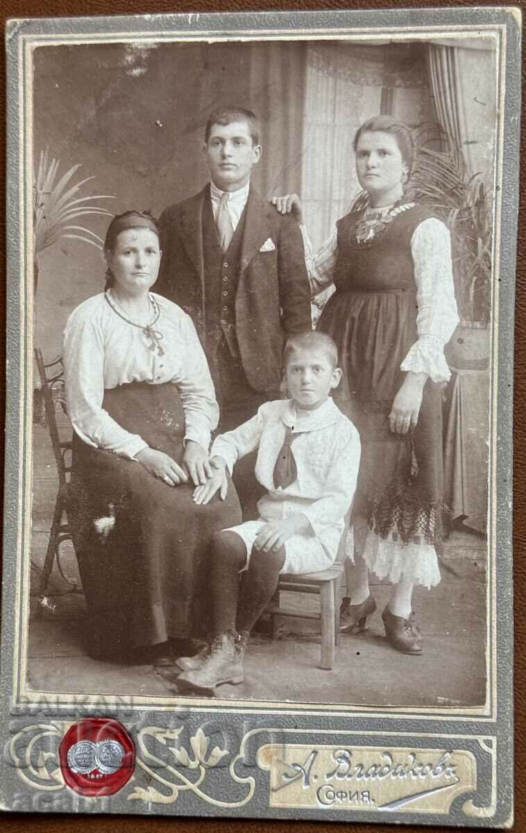 Old family photo on cardboard