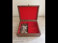 A wooden jewelry box with about 150 coins!