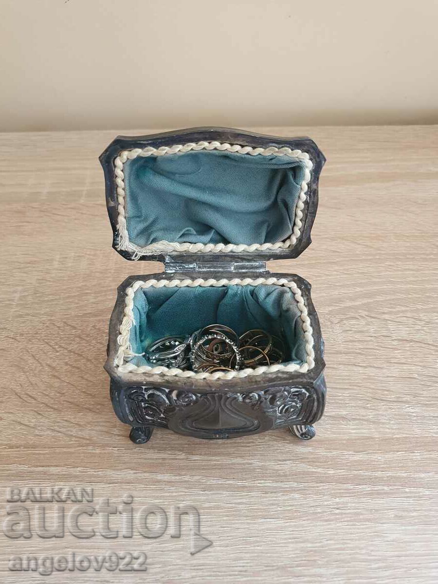 A beautiful metal jewelry box with jewelry!