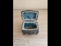 A beautiful metal jewelry box with jewelry!