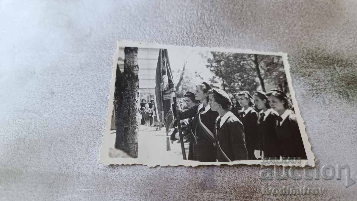 Photo Sofia Znamenosci with the flag at a high school holiday