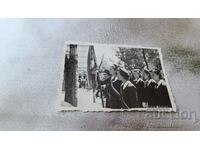 Photo Sofia Znamenosci with the flag at a high school holiday