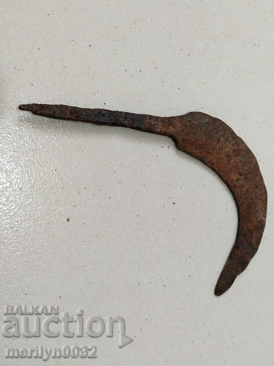 Old hand-forged scythe, wrought iron